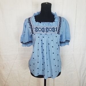 Chelsea and Theodore embroidered blue babydoll top